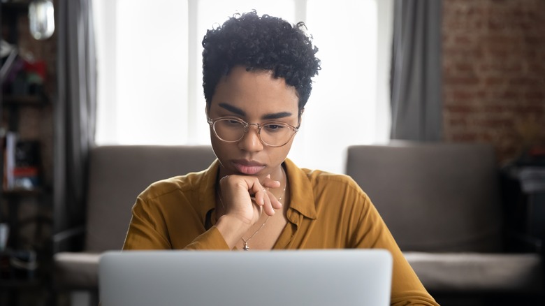 Woman looking at a laptop