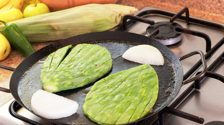 nopales and onions on a grill