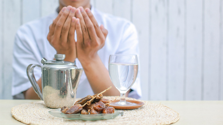 Muslim praying over food