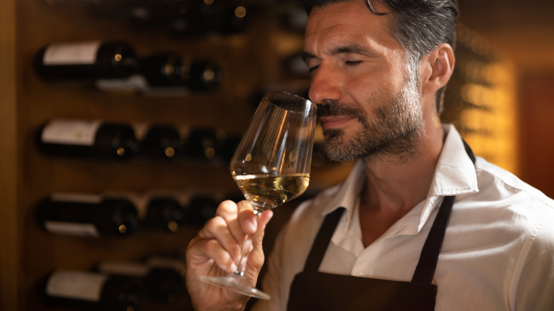 Man enjoying white wine