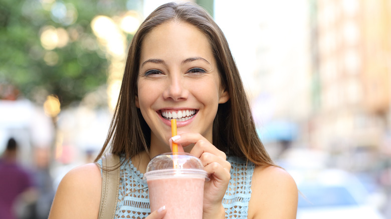 Woman smiling with drink