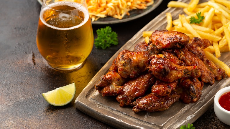 Glass of beer with wings