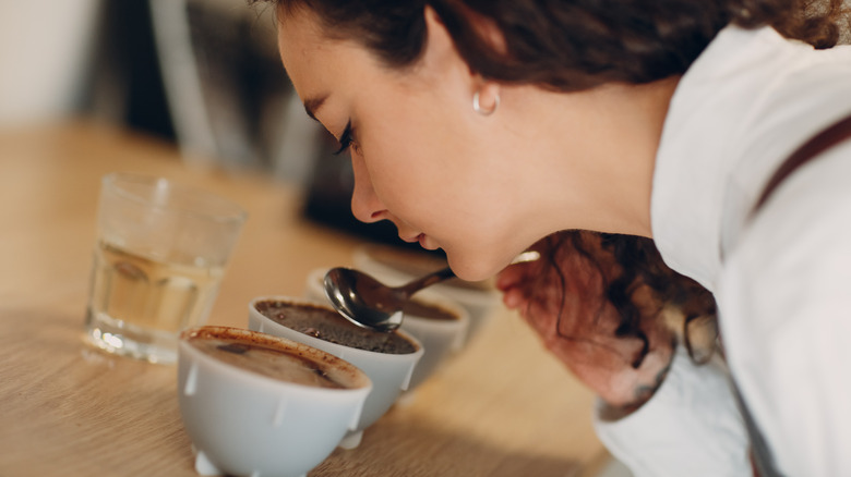 Woman cupping coffee