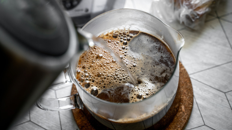 Boiling water poured over coffee