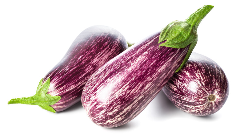 Graffiti eggplants against white background