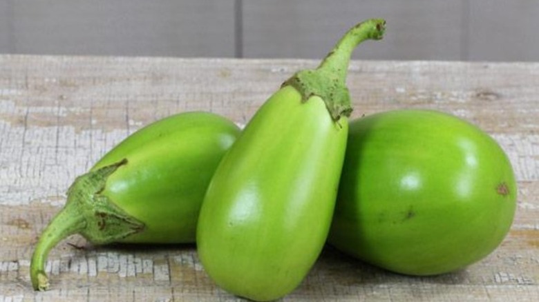 Little Green eggplants on table