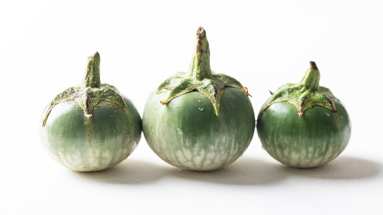 Thai eggplants against white background