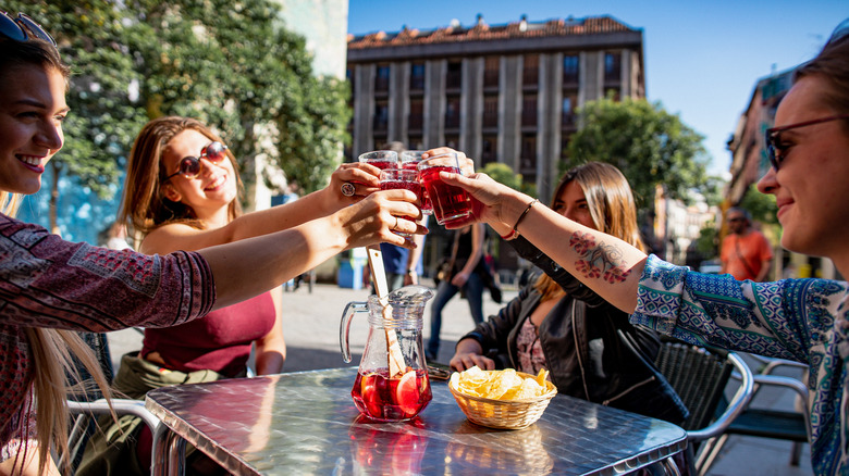 People clinking glasses in Madrid