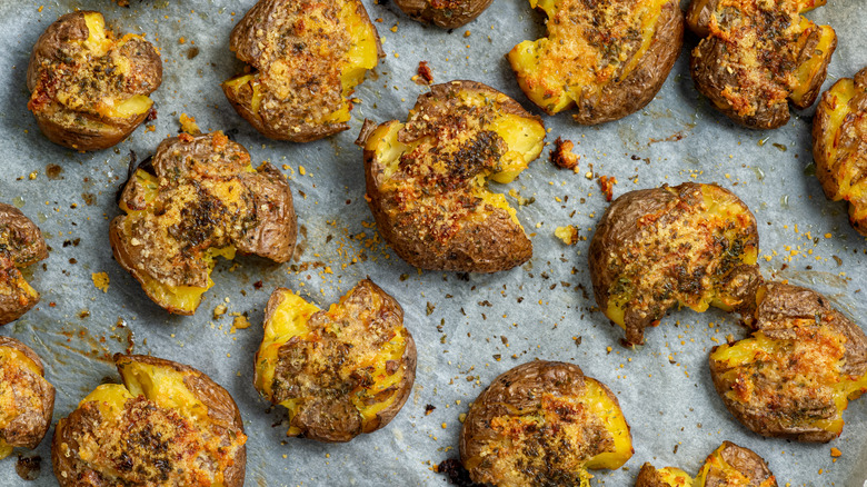 Smashed potatoes on baking tray