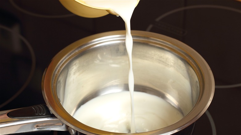 Milk poured into saucepan