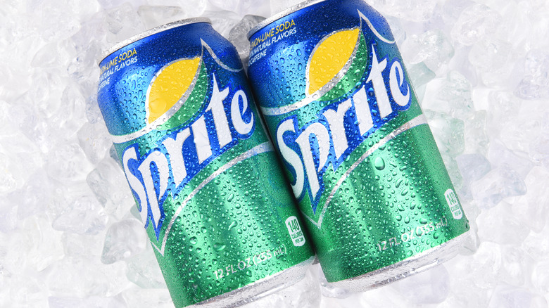 Two cans of Sprite on ice