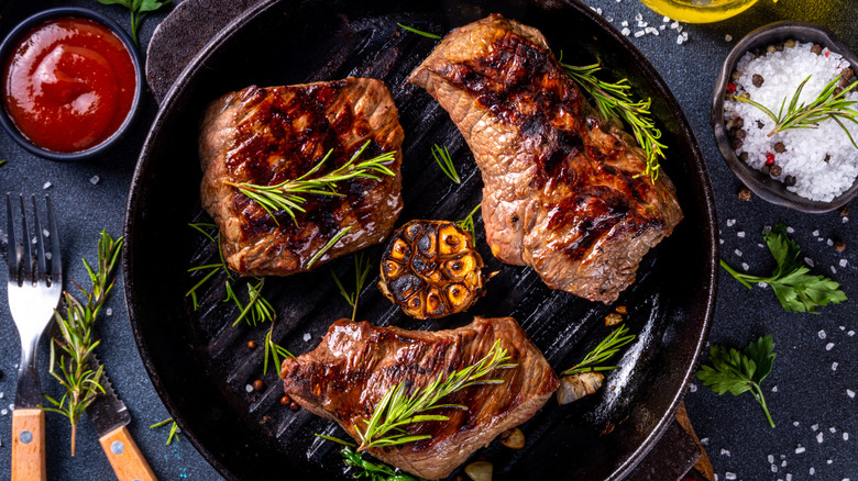 Steaks grilled in cast iron