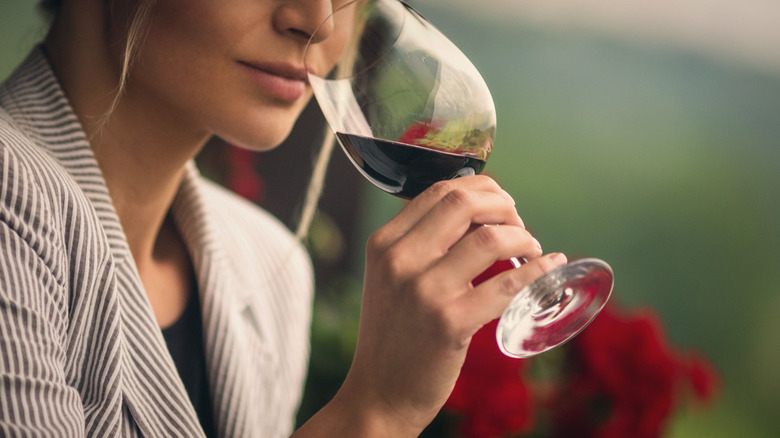 Woman drinking red wine