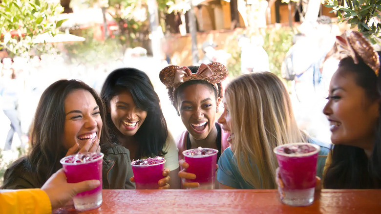 Friends enjoying drinks at Disney