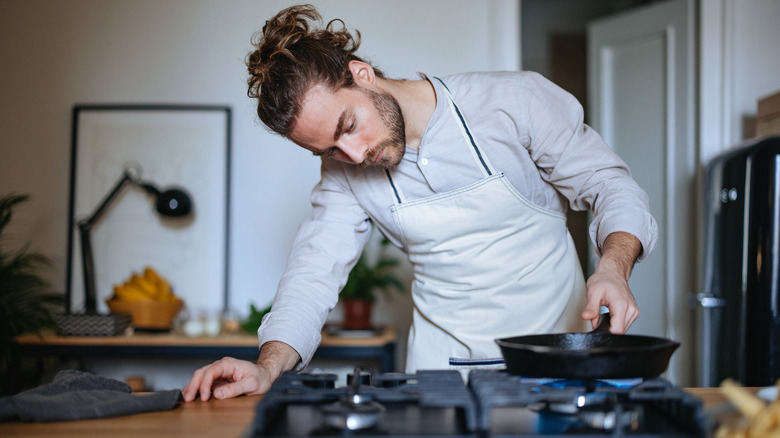 Man cooking on stove