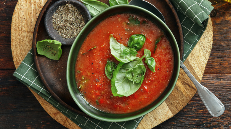 Bowl of tomato soup with fresh basil