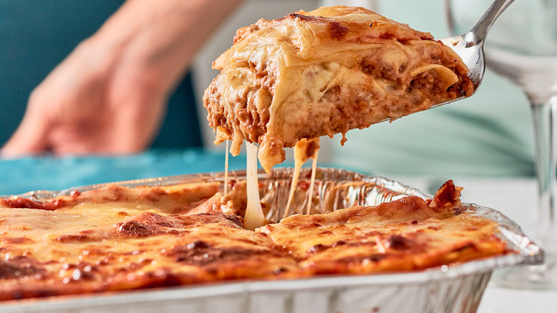 slice of lasagna pulled on fork