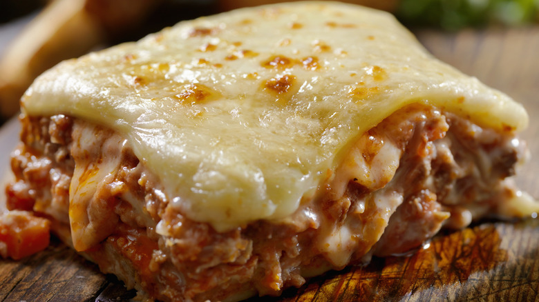 slice of meat lasagna on table