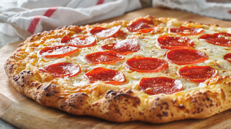 Pepperoni pizza on a cutting board