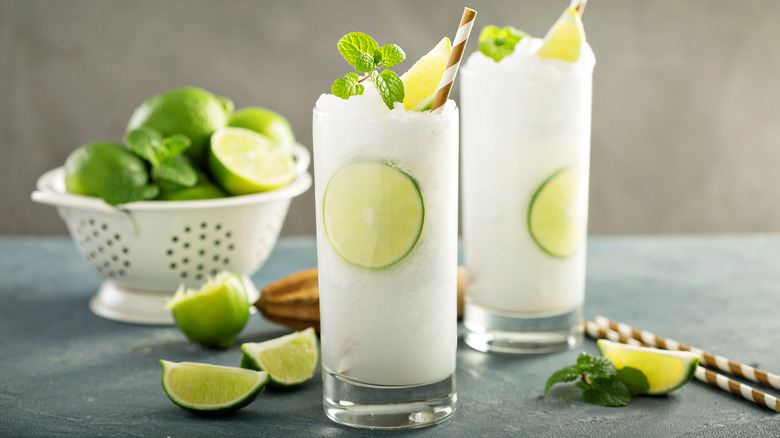 white slushy cocktail with lime