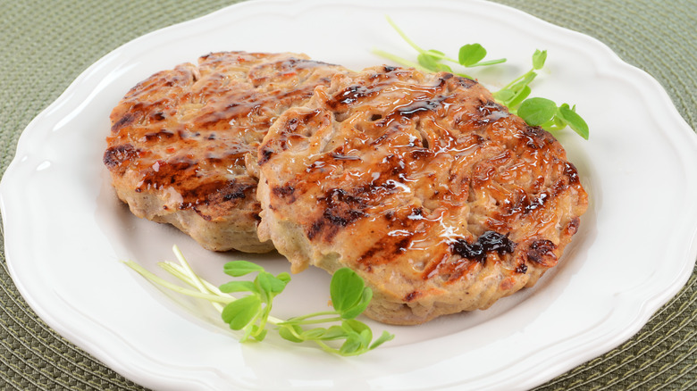 Turkey burgers on white plate 