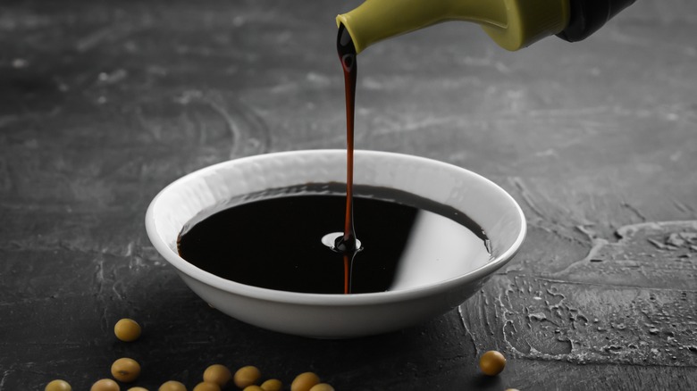 Soy sauce poured into bowl