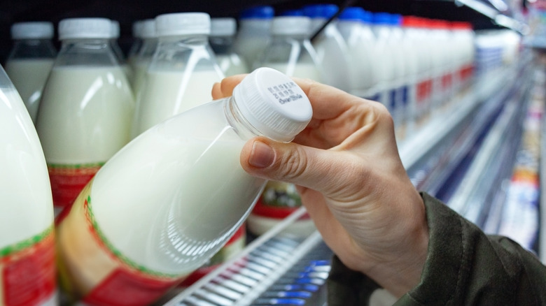 customer inspecting milk bottle label