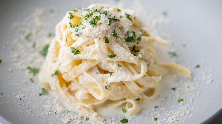 fettuccine Alfredo sprinkled with parsley