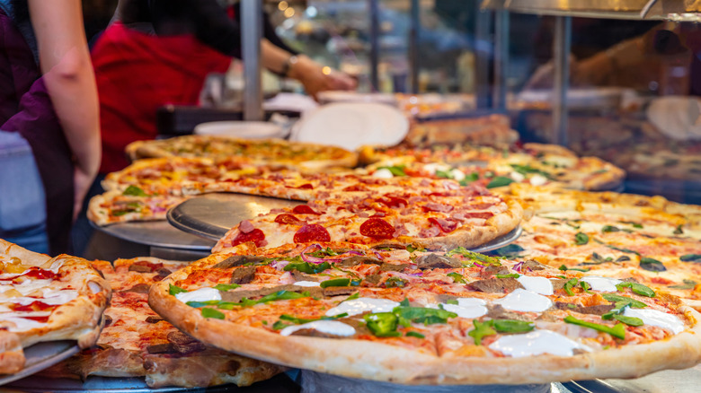 pizzas on display in window