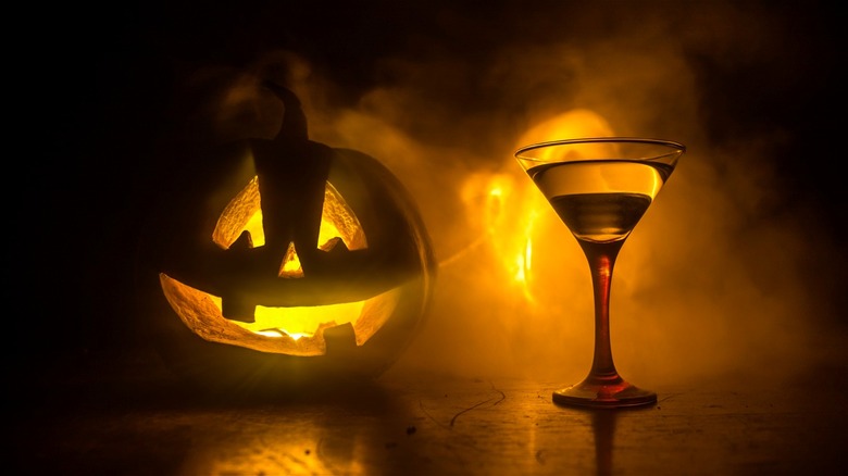 Jack-o'-lantern behind martini