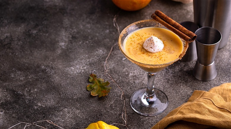 Pumpkin martini with cinnamon stick 