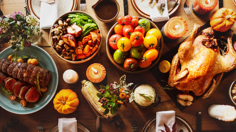 Thanksgiving food spread on wooden table