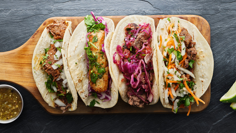 various tacos on serving platter