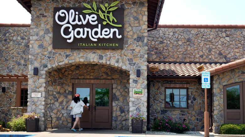 A person walks into an Olive Garden