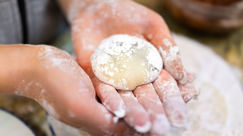 Person making mochi dough