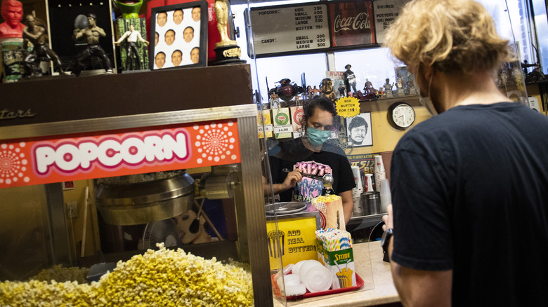 Man ordering movie popcorn