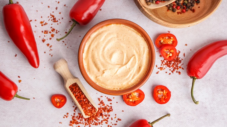 Bowl of spicy mayo with peppers