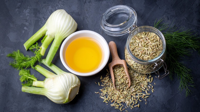 whole fennel and fennel seeds arranged on table