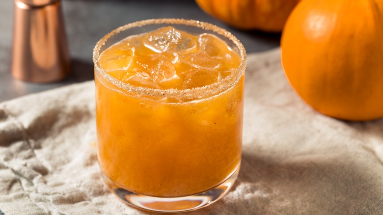 Pumpkin margarita on the rocks with spiced sugar rim