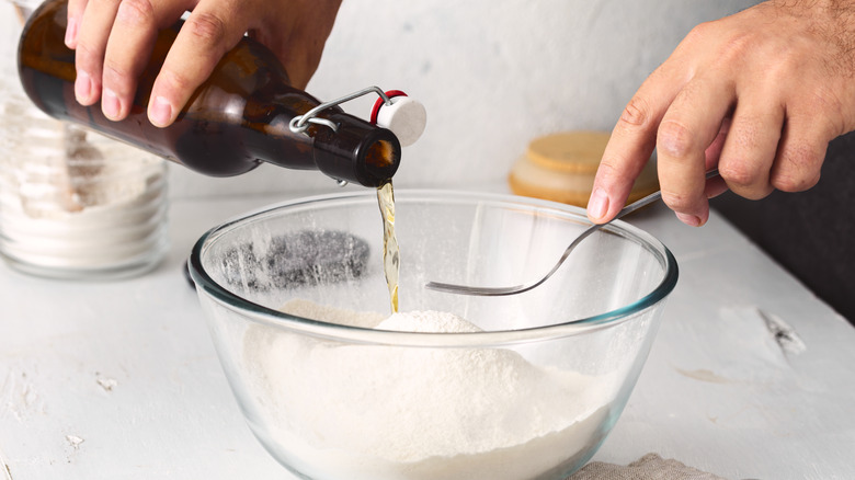 pouring beer into flour