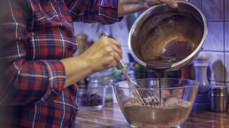 Person stirring brownie batter