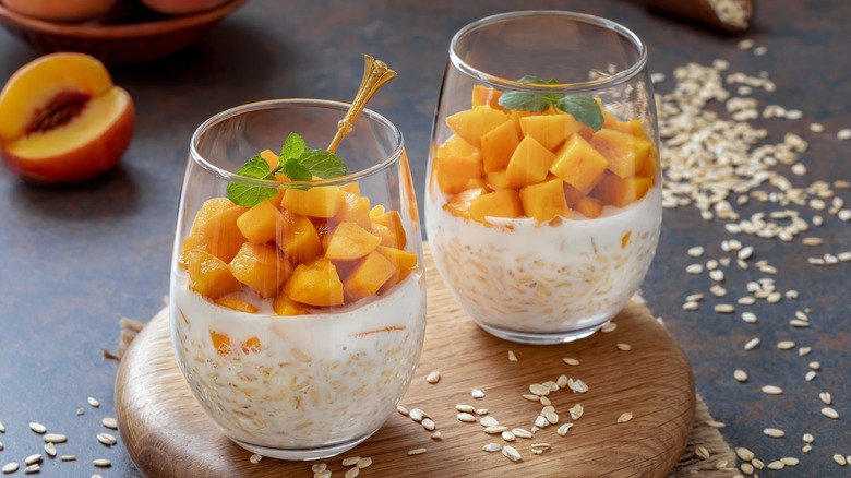 glasses of overnight oats with peaches