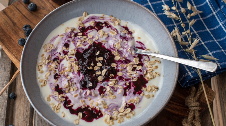 bowl of oatmeal with berry compote