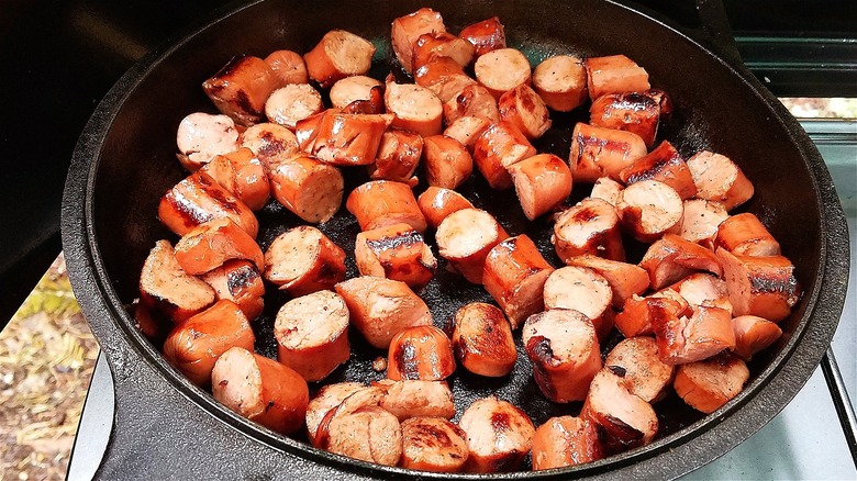 Sliced hot dogs in skillet 