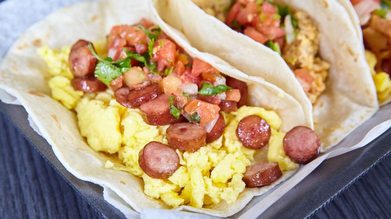 Hot dog-topped breakfast taco