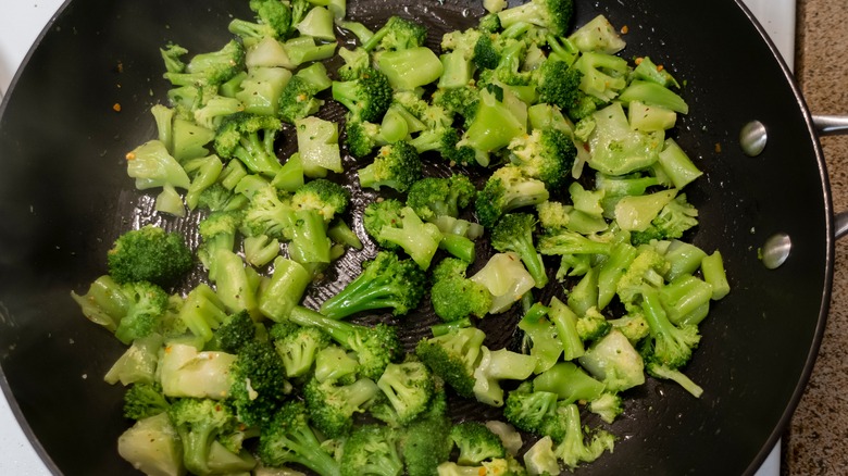 frozen broccoli sautéed in a skillet