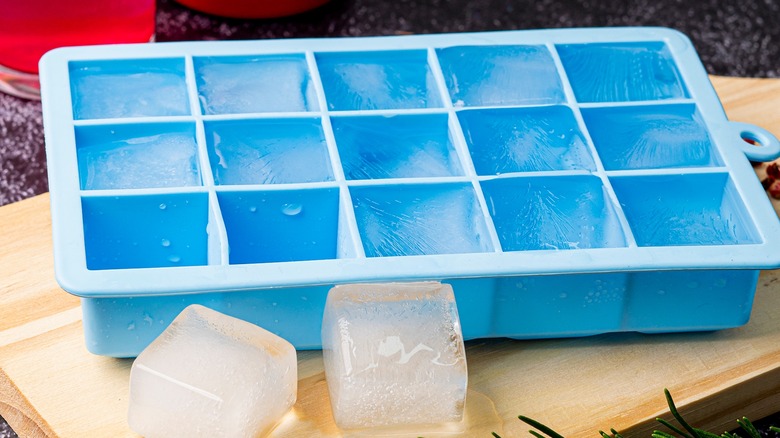 blue ice cube tray with ice cubes