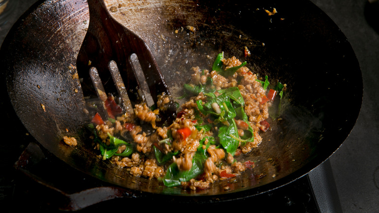 Pork and basil in a hot wok