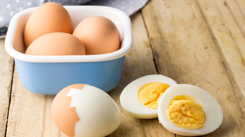 Hard-boiled eggs on wood