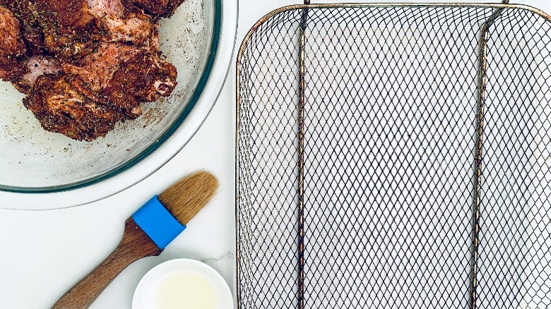 air fryer basket brushed with oil